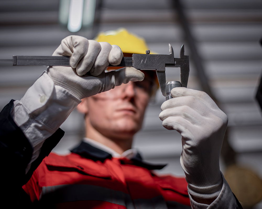 Person holding caliper gauge